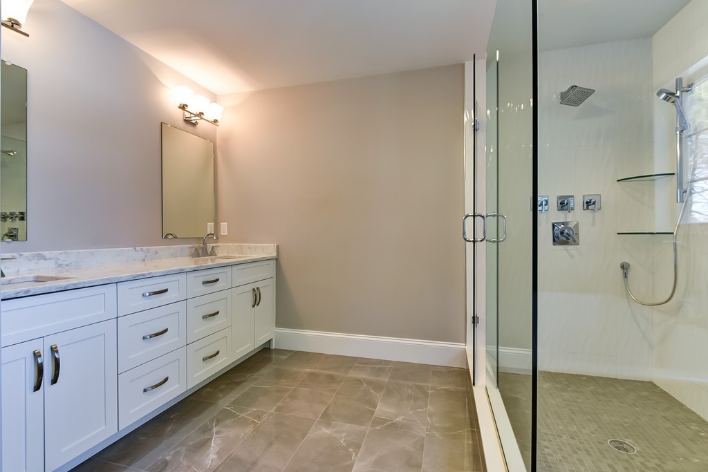 80 Evelyn Road Needham, MA 02494 - Photo 26 of 29 a bathroom with a granite countertop sink mirror and a shower