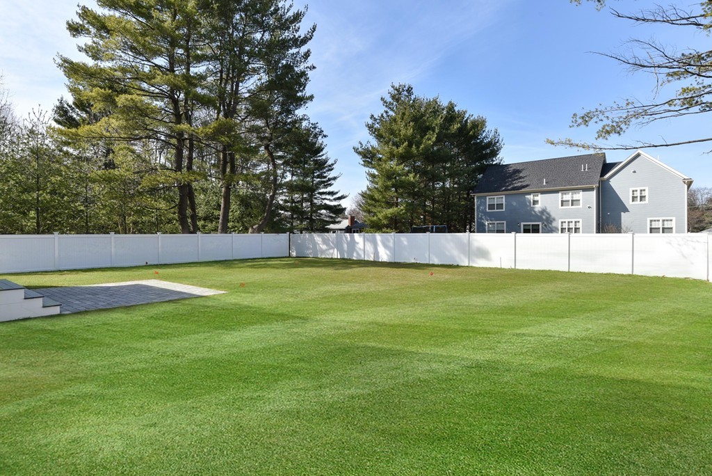 80 Evelyn Road Needham, MA 02494 - Photo 28 of 29 a view of yard with swimming pool and trees in the background