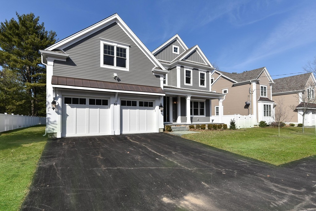 80 Evelyn Road Needham, MA 02494 - Photo 4 of 29 a front view of a house with a yard