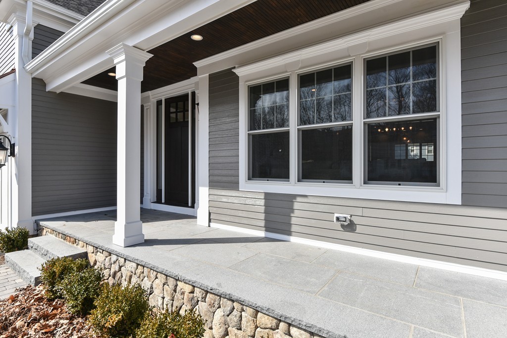 80 Evelyn Road Needham, MA 02494 - Photo 5 of 29 a view of a house with a large window