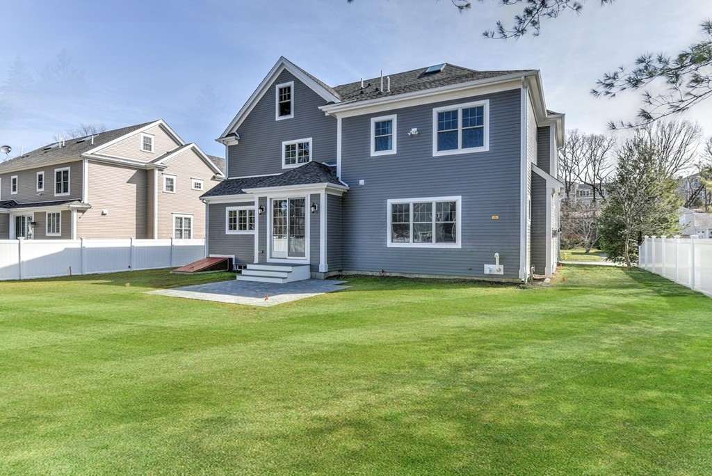 80 Evelyn Road Needham, MA 02494 - Photo 7 of 29 a front view of a house with a garden