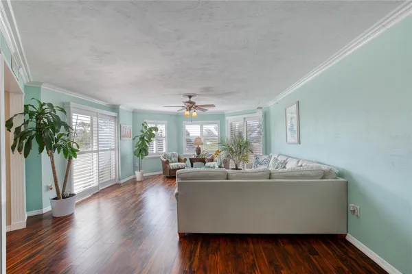 a balcony with furniture and a potted plant
