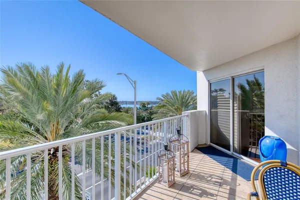 a spacious bathroom with a granite countertop sink a toilet a shower and a mirror