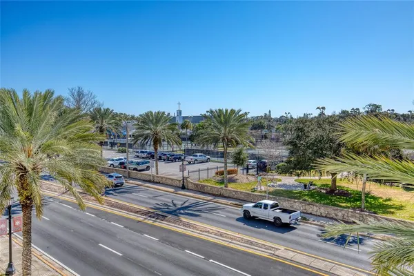 a bathroom with a granite countertop sink a toilet and a large mirror