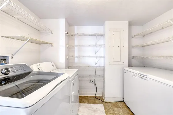 a white toilet sitting next to a window