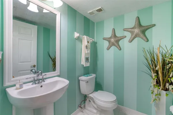 a spacious bathroom with a double vanity sink mirror and bathtub