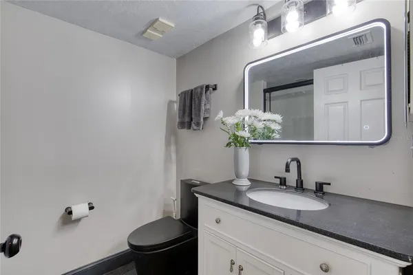 a spacious bedroom with a bed and a couch