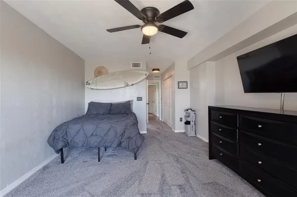 a dining room with furniture and a wooden floor