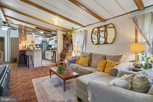 a living room with furniture and a table