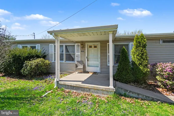front view of a house with a yard