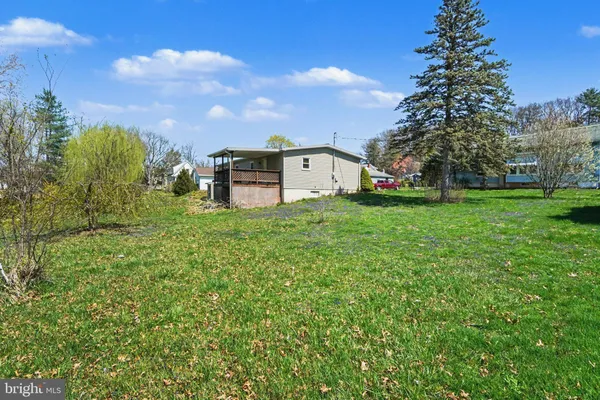 a view of a house with a big yard