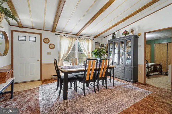 a view of a dining room with furniture