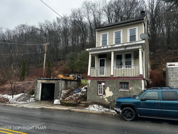 a car parked in front of a house