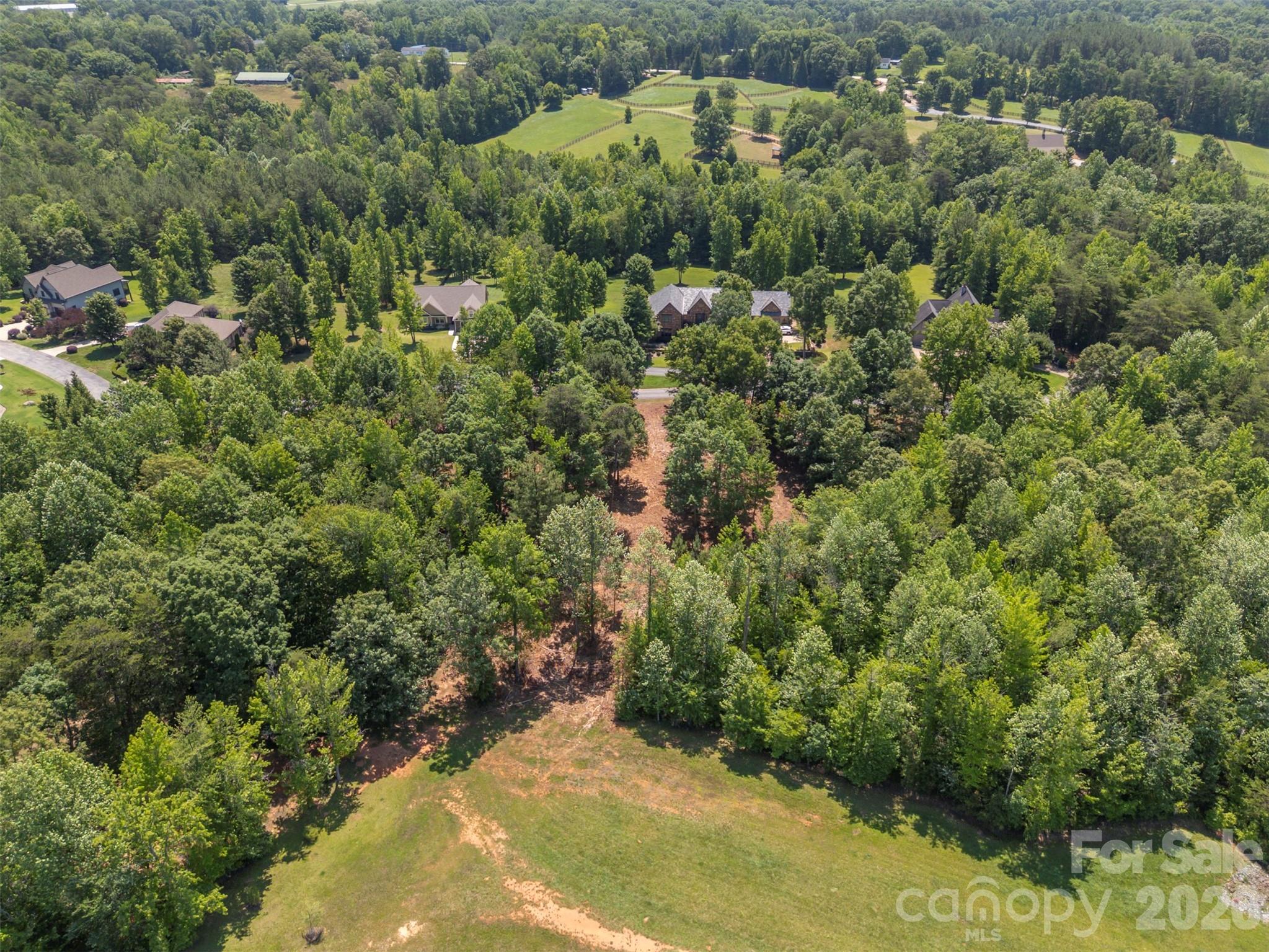 0 Doveridge Drive, Unit 66 Tryon, NC 28782 - Photo 9 of 21 an aerial view of a house with a yard