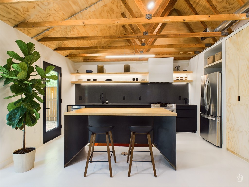 6007 Leisure Run Road Austin, TX 78745 - Photo 1 of 26 a room with stainless steel appliances kitchen island granite countertop furniture a counter top and a potted plant