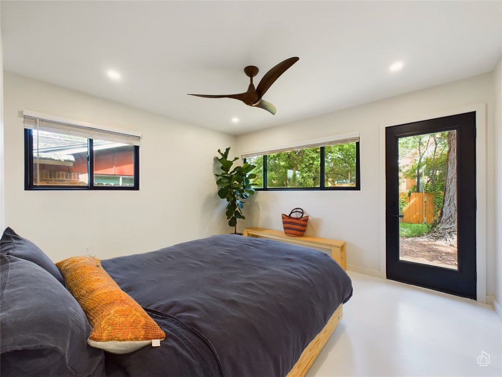 6007 Leisure Run Road Austin, TX 78745 - Photo 11 of 26 a bedroom with a bed and a painting on the wall