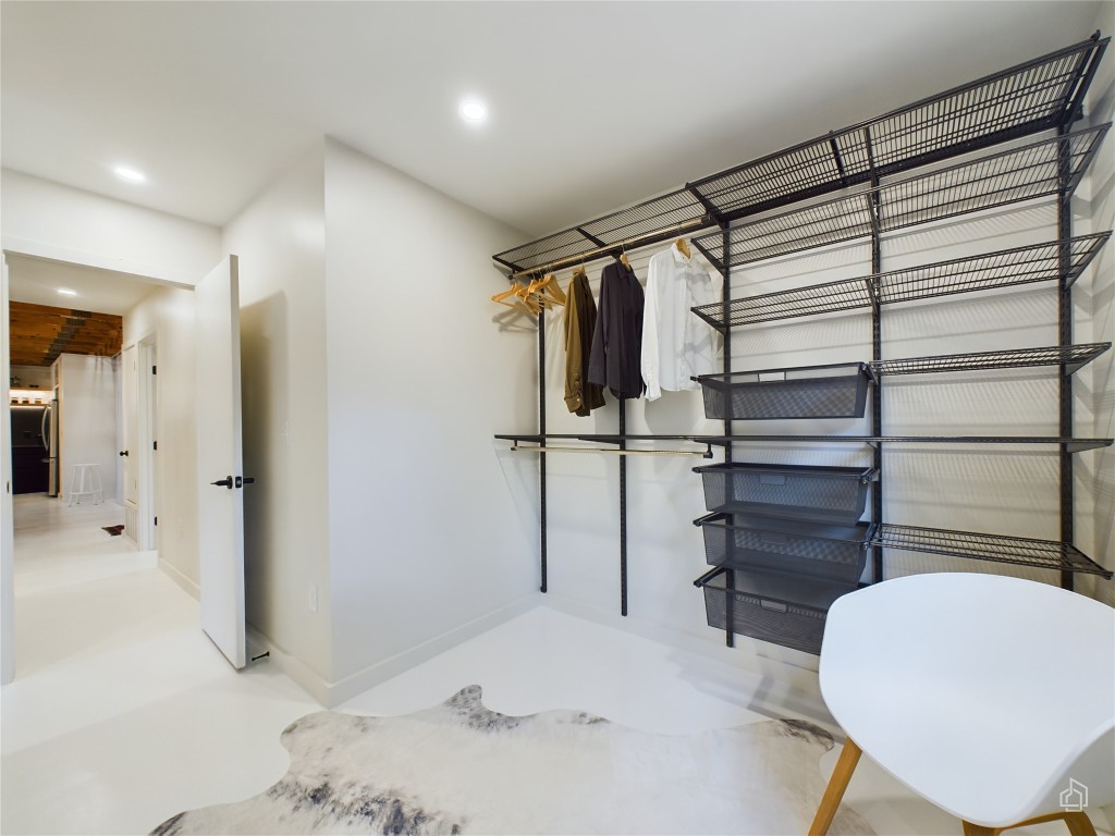 6007 Leisure Run Road Austin, TX 78745 - Photo 16 of 26 a view of walk in closet and bedroom