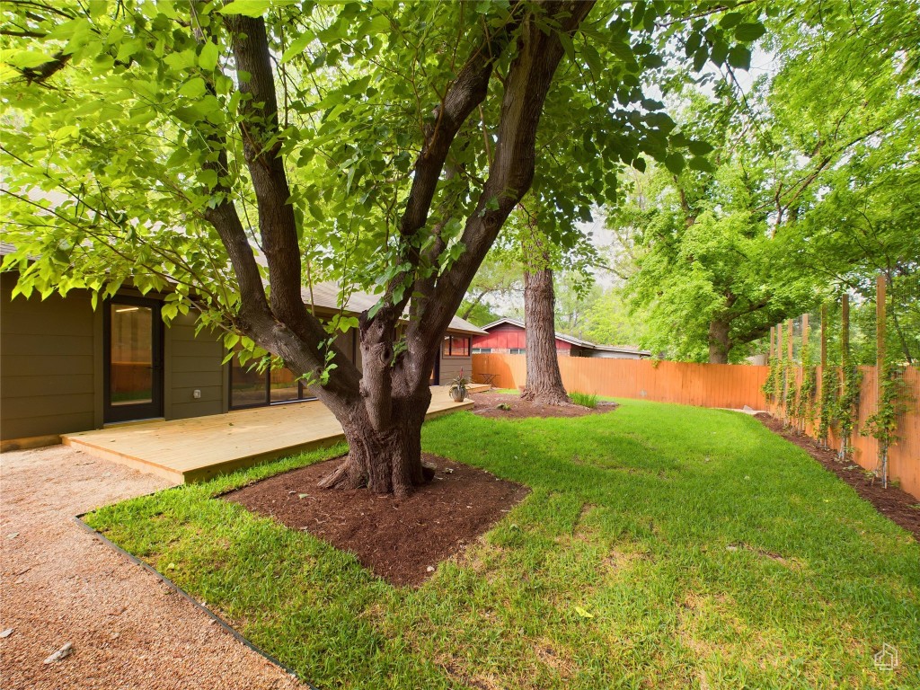 6007 Leisure Run Road Austin, TX 78745 - Photo 26 of 26 a tree in the middle of a garden