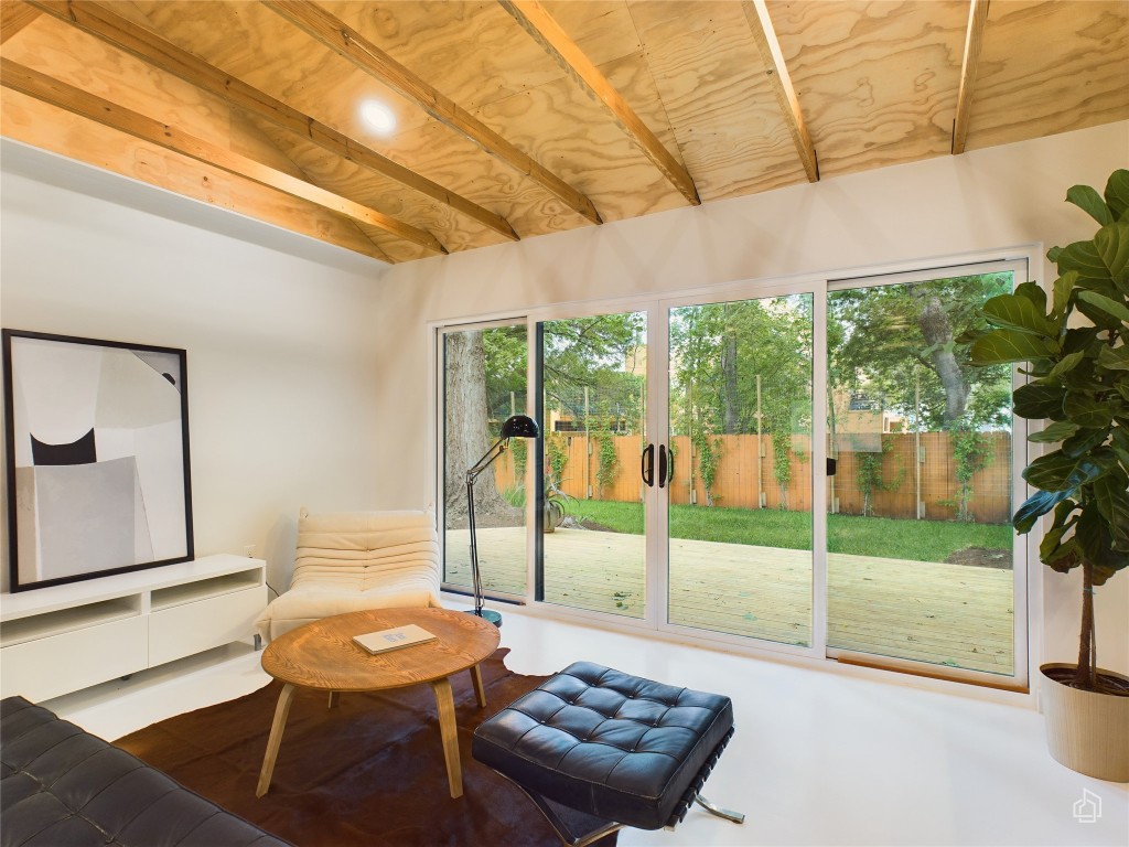6007 Leisure Run Road Austin, TX 78745 - Photo 6 of 26 a living room with furniture and a floor to ceiling window