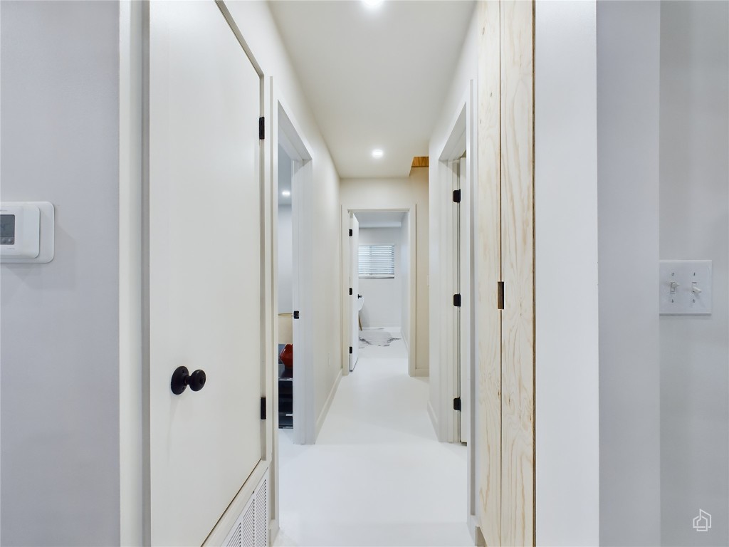6007 Leisure Run Road Austin, TX 78745 - Photo 9 of 26 a bathroom with a glass shower door