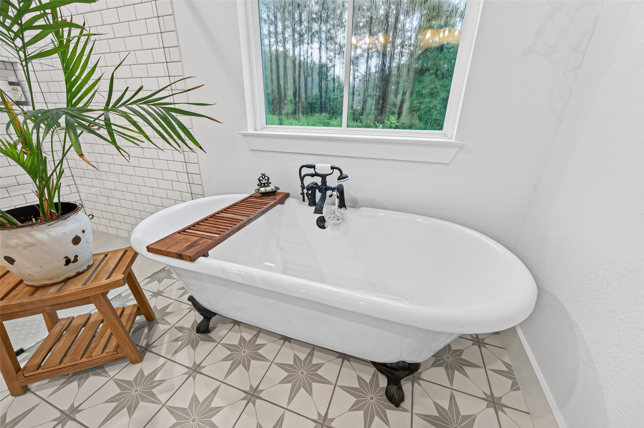 10915 Ruger Road Willis, TX 77378 - Photo 26 of 50 a white bath tub sitting in a bathroom next to a window