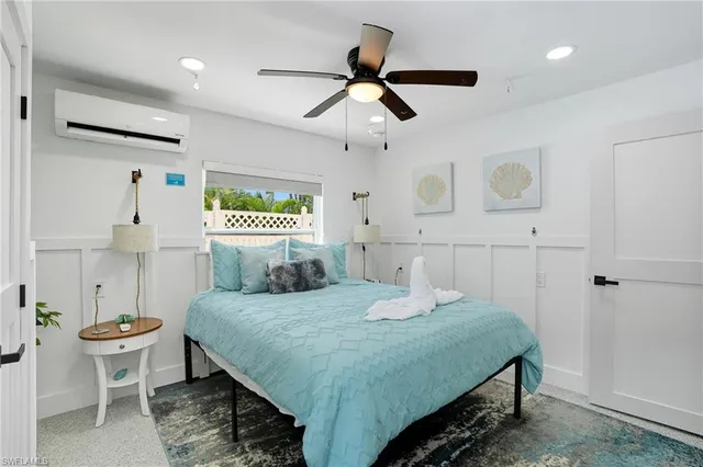 a bedroom with a bed and a table in it