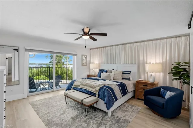 a spacious bedroom with a large bed and a couch