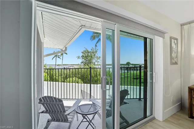 a balcony view with a outdoor seating space