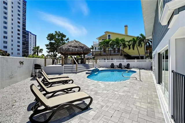 a view of a swimming pool with a patio