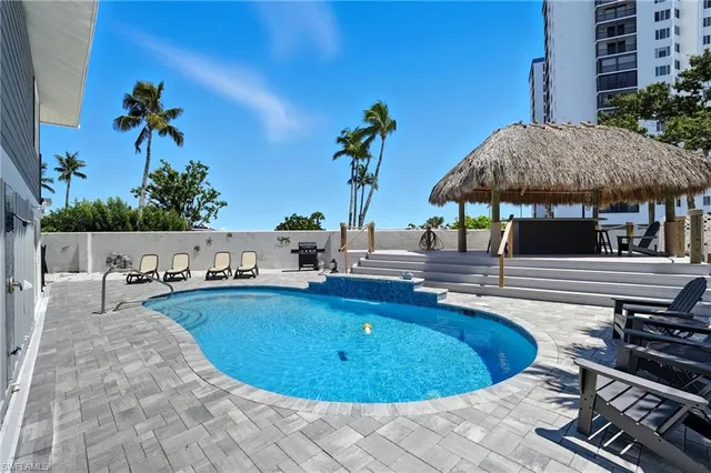 a dining space with furniture and wooden floor