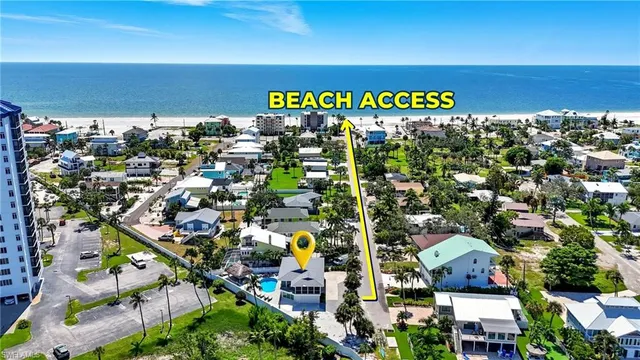 an aerial view of a houses with a yard