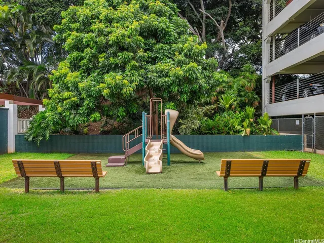 a kitchen with a refrigerator and a stove