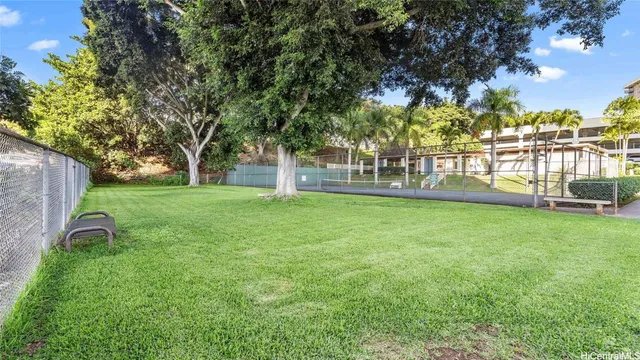 a view of a swimming pool with outdoor seating