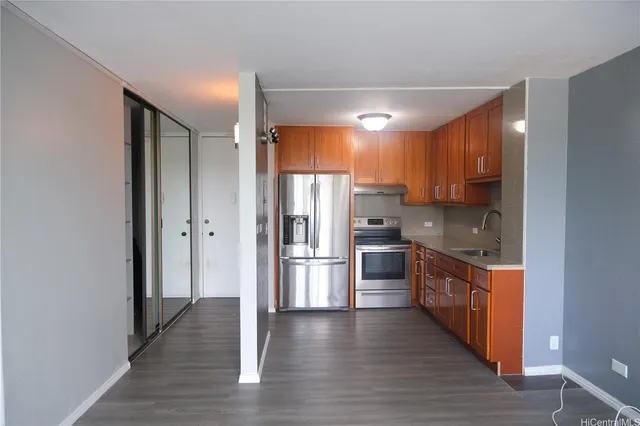 a kitchen with stainless steel appliances a refrigerator and a sink