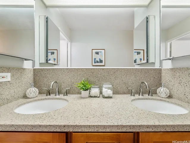 a bathroom with sink and mirror