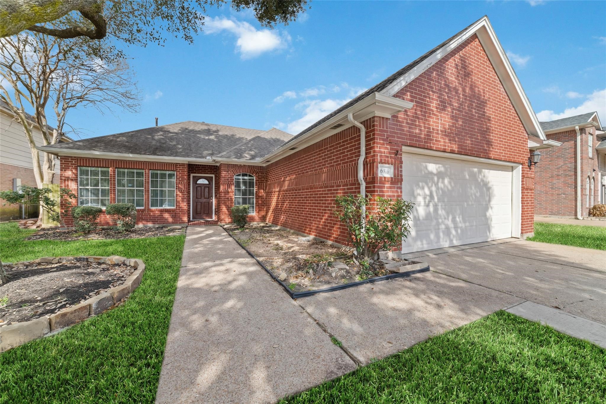 6315 Laurel Run Houston, TX 77084 - Photo 9 of 9 a view of a house with a yard