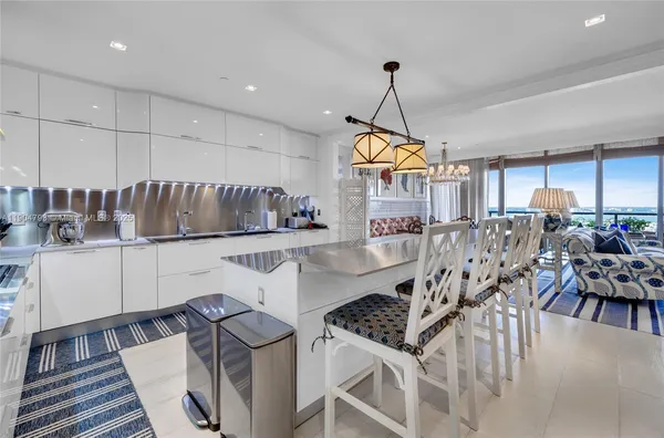 a kitchen with a table chairs stove and cabinets