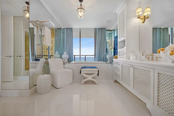 a bathroom with a double vanity sink and a bathtub