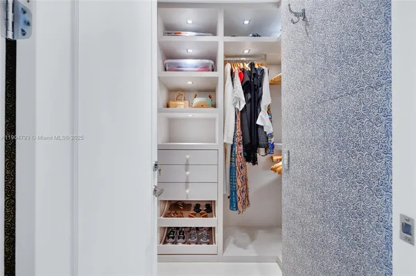 a spacious bathroom with a granite countertop sink a toilet and shower