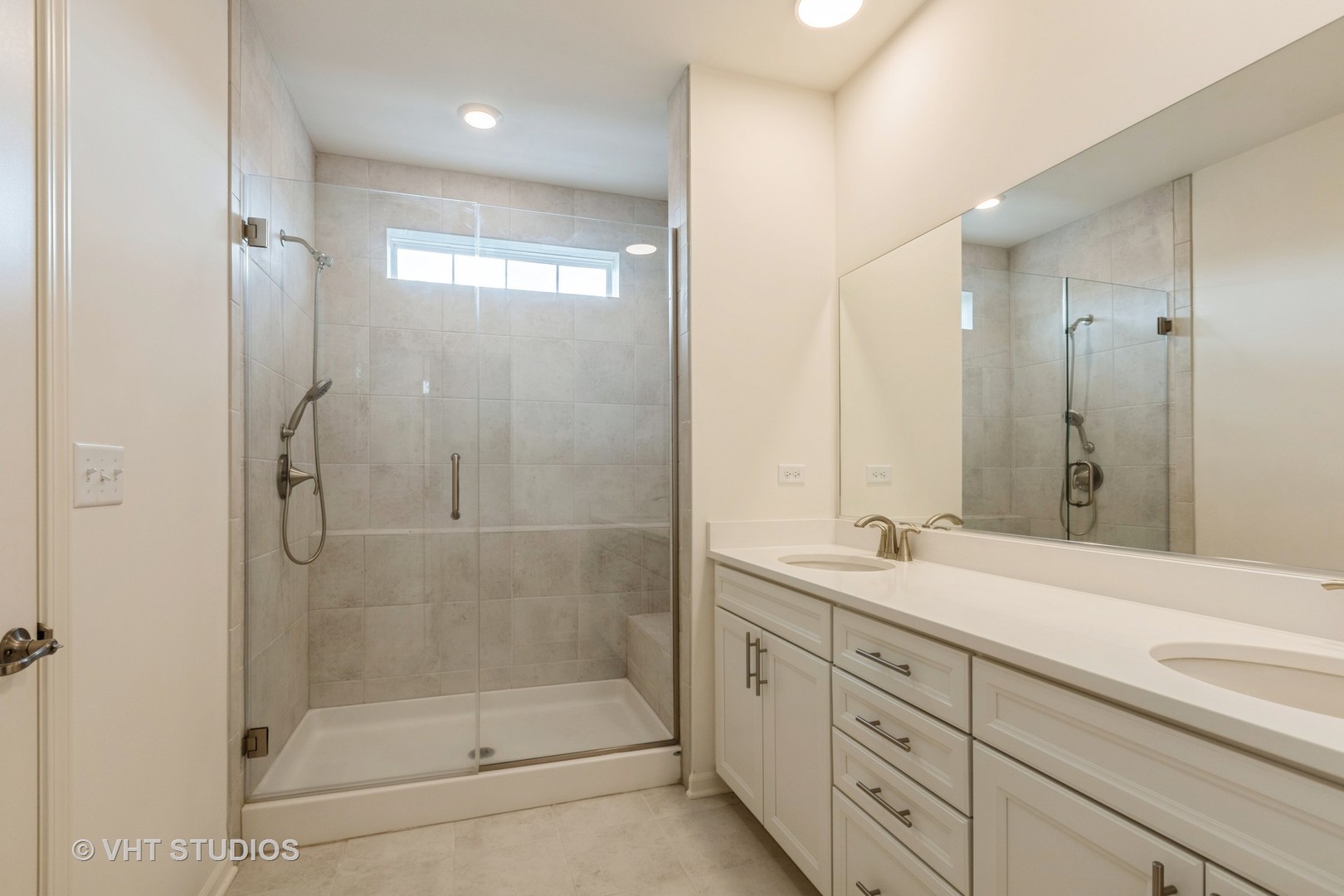 2950 Reflection Drive Naperville, IL 60564 - Photo 11 of 17 a bathroom with a shower sink and mirror
