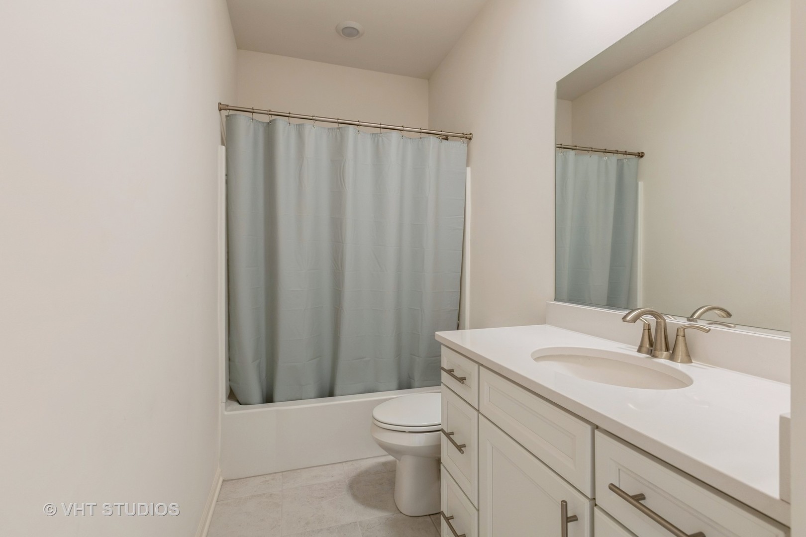2950 Reflection Drive Naperville, IL 60564 - Photo 12 of 17 a bathroom with a sink a toilet and shower curtain