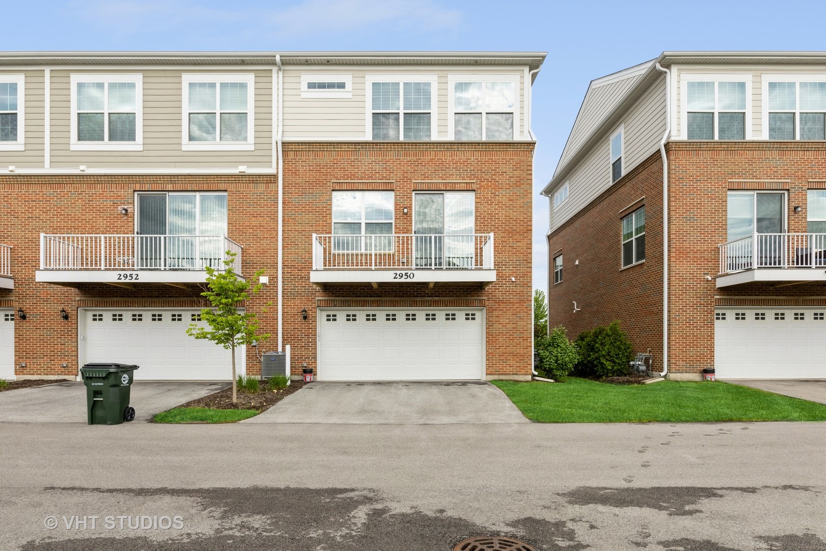 2950 Reflection Drive Naperville, IL 60564 - Photo 16 of 17 a front view of a building with a yard and parking space