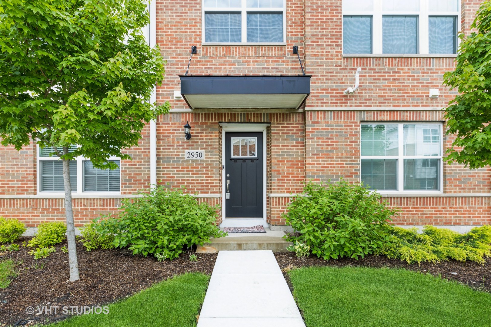 2950 Reflection Drive Naperville, IL 60564 - Photo 2 of 17 a front view of a house with garden