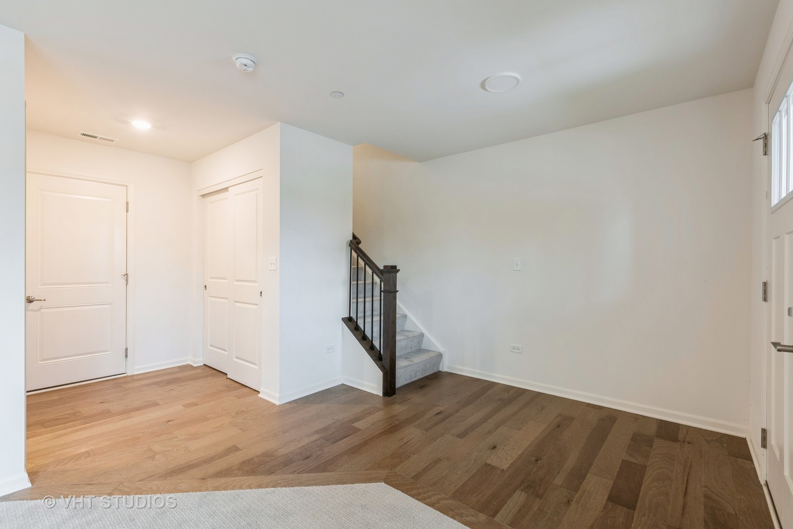 2950 Reflection Drive Naperville, IL 60564 - Photo 4 of 17 a view of an empty room with wooden floor and closet