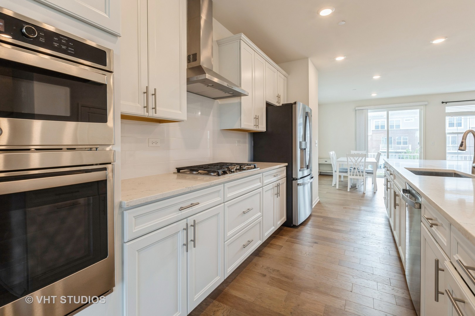 2950 Reflection Drive Naperville, IL 60564 - Photo 8 of 17 a kitchen with stainless steel appliances a stove microwave and cabinets