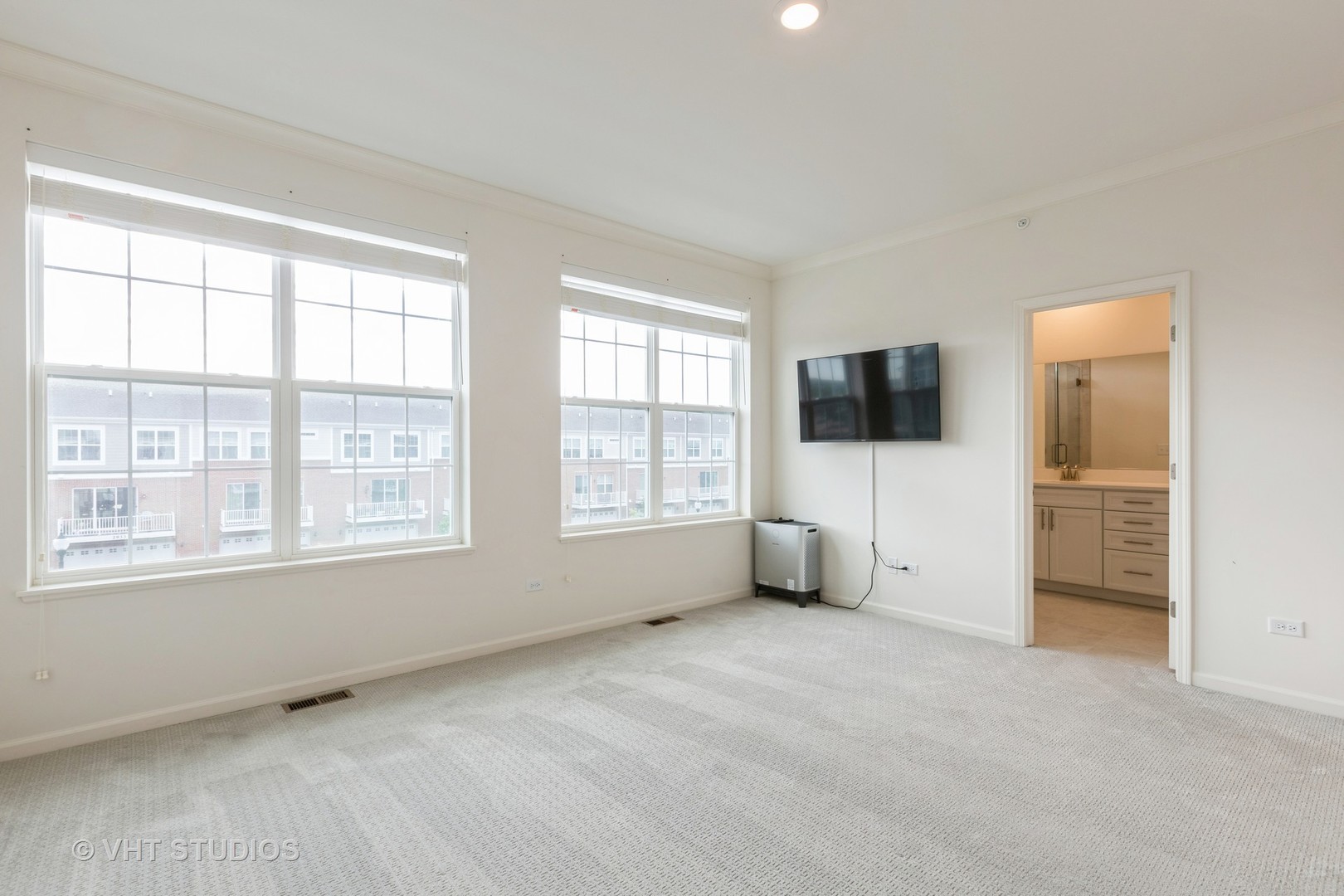 2950 Reflection Drive Naperville, IL 60564 - Photo 10 of 17 a view of an empty room with a window and a flat screen tv