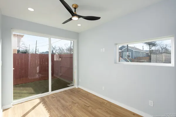 a bathroom with a bathtub shower sink vanity and toilet
