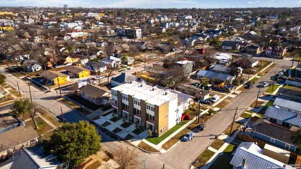a kitchen with a refrigerator and a sink