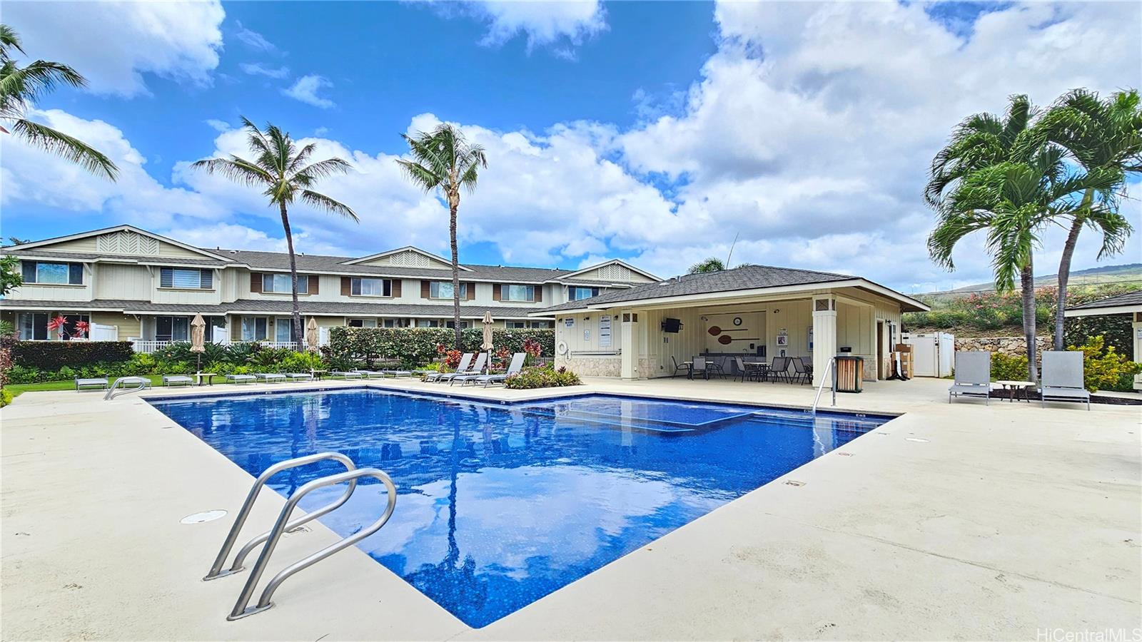 92-1490 Ali'inui Drive, Unit 803 Kapolei, HI 96707 - Photo 15 of 20 a front view of house with yard outdoor seating and barbeque oven