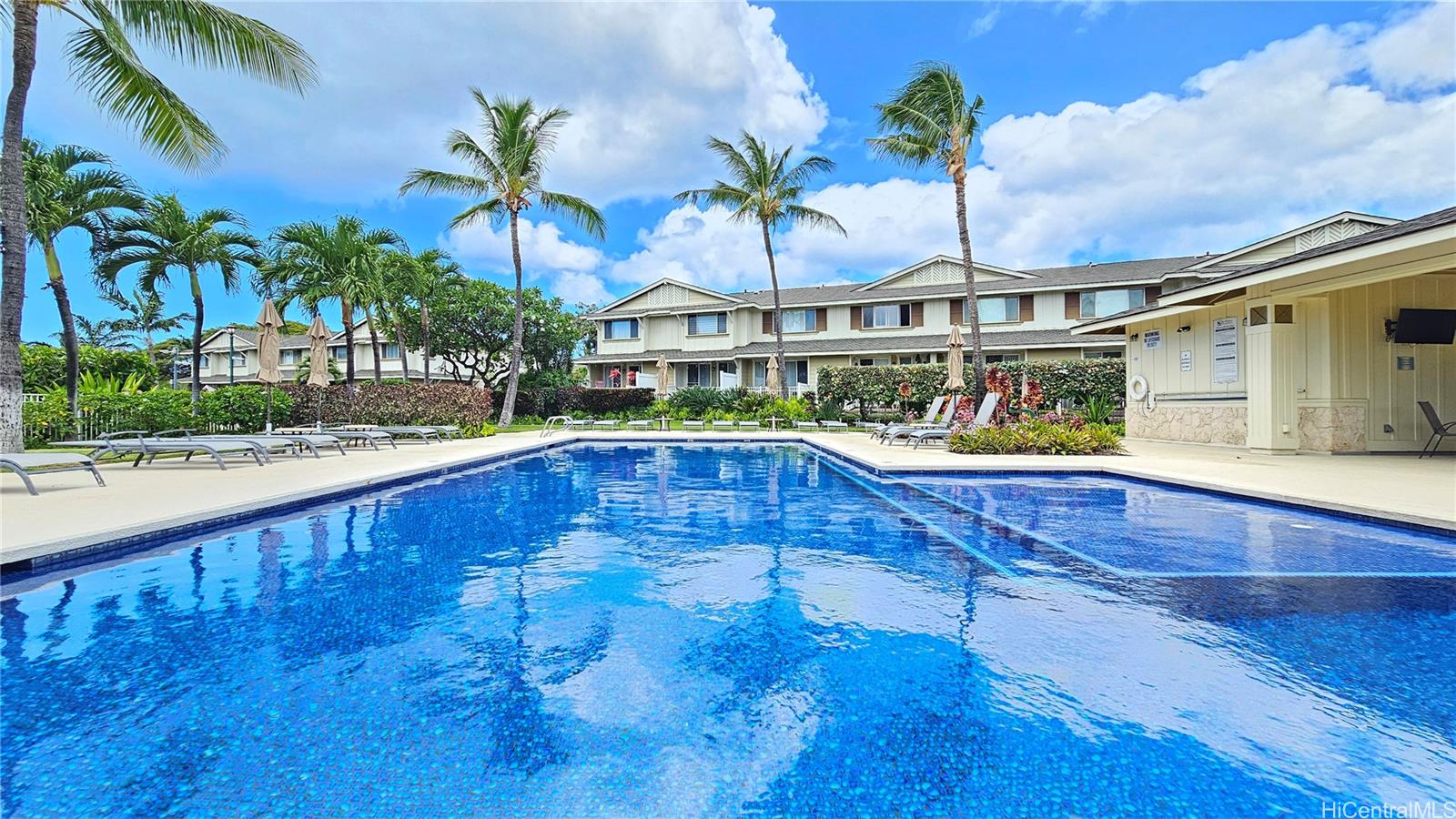 92-1490 Ali'inui Drive, Unit 803 Kapolei, HI 96707 - Photo 16 of 20 a view of swimming pool with outdoor seating and deck